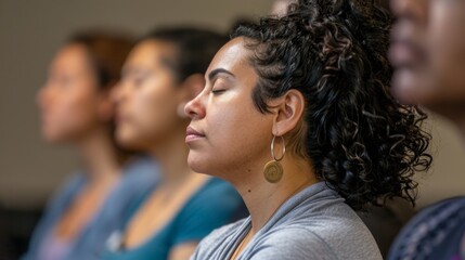 A workshop session focused on mindfulness and its positive effects on brain health with attendees practicing meditation