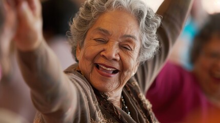 A closeup of an older womans face beaming with joy and satisfaction as she dances in a group with her peers