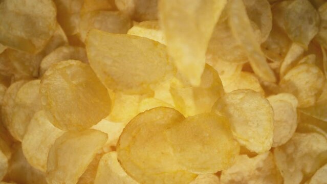 Super Slow Motion Shot of Falling Potato Chips Followed by Camera at 1000 fps.
