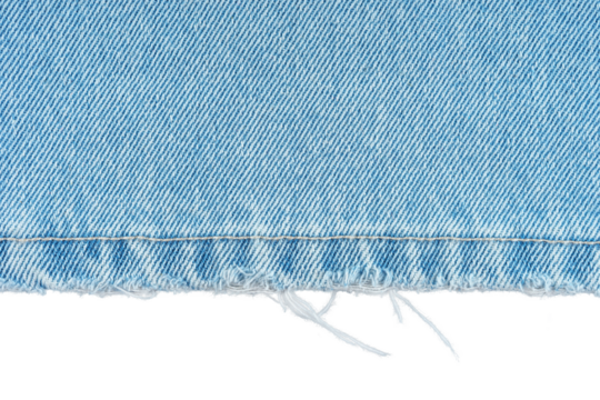 Blue denim jeans pants edge isolated on white, transparent background, close up, macro. Ripped jeans stich, destroyed torn. Wallpaper, backdrop, design detail.