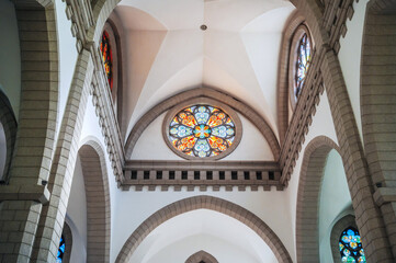 ceiling inside the Catholic church with mosaics on stained glass windows. Cathedral of the Sacred Heart of Jesus in Tashkent in Uzbekistan