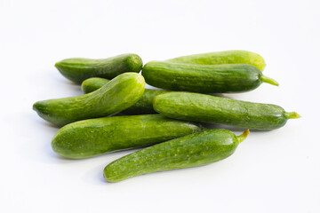 Mini cucumbers on white background.