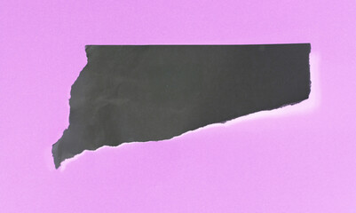 Ripped paper on black background, empty space