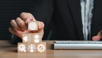 Advice concept, Businesswoman hand holding wooden block on desk with Advice icon on virtual screen.