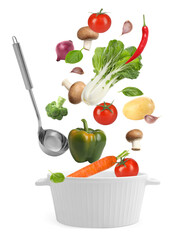 Fresh ingredients falling into saucepan on white background