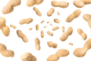 Unpeeled peanuts in air on white background