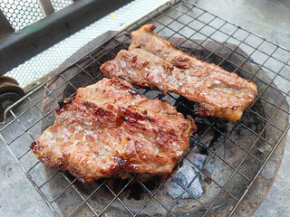 grilled pork steak on grill