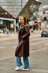 Fototapeta premium A Casual Girl Poses with Confidence and Style on Urban Streets