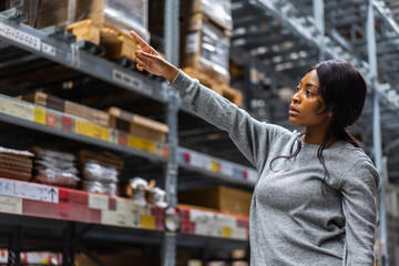 Portrait african american engineer woman shipping order detail export and import,goods,factory,warehouse,international trade,transportation,cargo ship,logistic,distribution.business industry