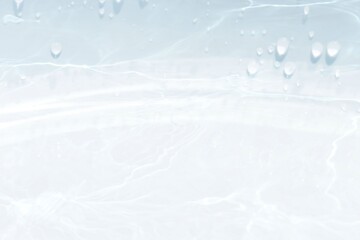 Blue water with ripples on the surface. Defocus blurred transparent blue colored clear calm water surface texture with splashes and bubbles. Water waves with shining pattern texture background.	