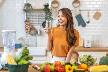 Portrait asian beauty body slim woman drinking water from a bottle while relax and feeling fresh,  refresh drink, wellness, diet, healthcare, mineral at home.Healthy liquid lifestyle concept
