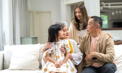 Portrait of happy love family asian father and mother playing with adorable asian kid girl.daughter, care, insurance.Happy family moments good time love with grandparents.Love of big family