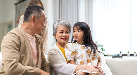 Portrait of happy love family asian father and mother playing with adorable asian kid girl.daughter, care, insurance.Happy family moments good time love with grandparents.Love of big family
