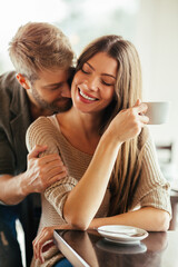 Loving couple sharing a coffee moment at a cozy cafe