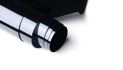 Roll of automobile film before installed to glass surface isolated on white