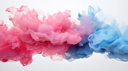 Vibrant pink and blue ink clouds underwater creating a striking abstract art composition on a white background.