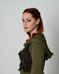 head and shoulders close up portrait of beautiful red haired female model, wearing  medieval...