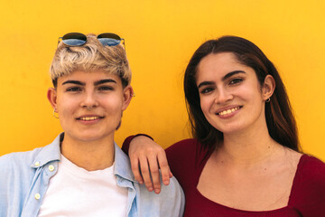 two beautiful teenager girls smiling portrait. close-up