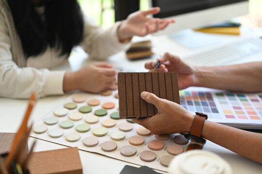 Interior designer helping client choosing colors and materials for home renovation