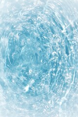 Blue water with ripples on the surface. Defocus blurred transparent blue colored clear calm water surface texture with splashes and bubbles. Water waves with shining pattern texture background.	