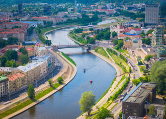 Obraz premium Vilnius, Lithuania. Aerial view of new city center with skyscrapers. Panoramic drone photo