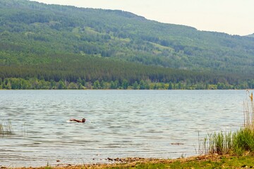 Alpine lake talkas against the backdrop of the Irendyk ridge of the Southern Urals in the Republic of Bashkortostan