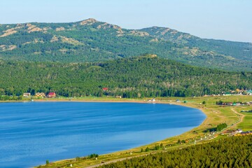 Alpine lake talkas against the backdrop of the Irendyk ridge of the Southern Urals in the Republic of Bashkortostan
