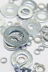 Steel fasteners, bolts and nuts are used in construction.