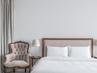 Modern hotel room with elegant bedding and stylish decor. Neutral tones and use of natural light.