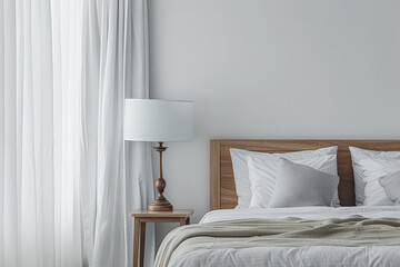 Modern hotel room with elegant bedding and stylish decor. Neutral tones and use of natural light.