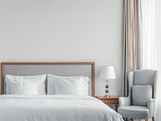 Modern hotel room with elegant bedding and stylish decor. Neutral tones and use of natural light.