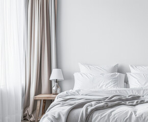 Modern hotel room with elegant bedding and stylish decor. Neutral tones and use of natural light.