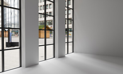 A large, bright room with white walls and high windows.