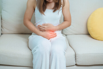 woman having abdomen ache due to Stomach pain, digestion with constipation or Diarrhea from food...