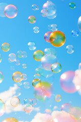 Obraz premium A bunch of colorful bubbles floating in the sky. The bubbles are of different colors and sizes, creating a vibrant and playful atmosphere. The blue sky serves as a backdrop, emphasizing the bright