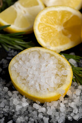 slices of sour lemon on a black board