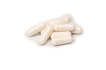 White pill capsule isolated on a white background.