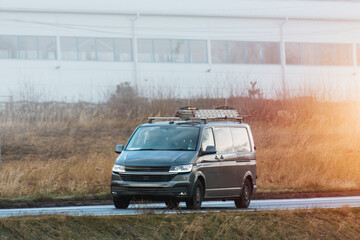 Work van equipped with tools and ladder in transit © AlexGo