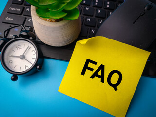 Sticky note with the word FAQ frequently asked question