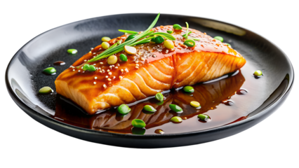 a piece of cooked salmon topped with sesame seeds and green onions, served on a black plate with a soy-based sauce