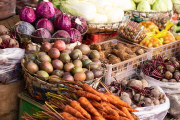 Fresh vegetables on display in a traditional market
