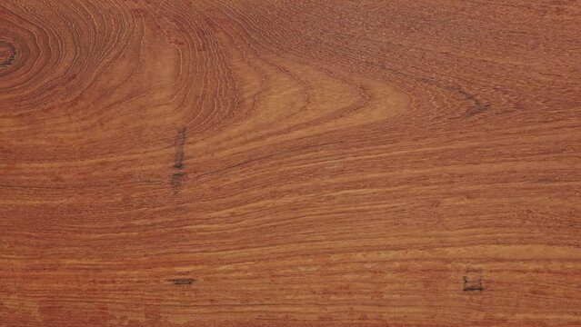 Teak wood tabletop background. Teak wood texture background. Horizontal shot of long teak wood tabletop. Empty tabletop. texture of wood