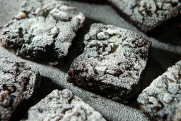 Chocolate brownies on a dark background	