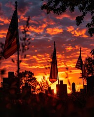 Naklejka premium Dramatic sunset with American flags silhouetted against a vibrant sky, creating a striking scene of patriotism and natural beauty.