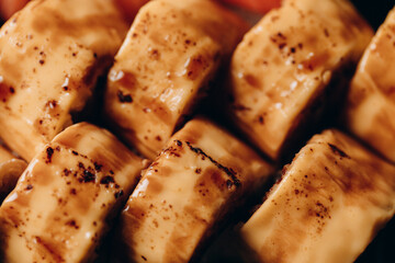 Delicious fresh and juicy roll prepared on the grill with salmon. With cream cheese, avocado, wasabi and ginger