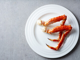 Boiled crab legs on a plate	