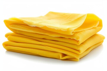Folded slices of cheddar cheese on a white background, a classic and savory option for any dish