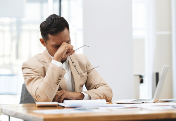 Tired young businessman feel pain eyestrain,  fatigued from computer work, stressed businessman...