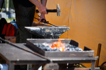 blacksmith working on a metal