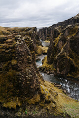 Fjaðrá river flowing through beautiful Fjadrargljufur canyon. Southern Iceland. Autumn overcast day. It is located near the Ring Road, not far from the village